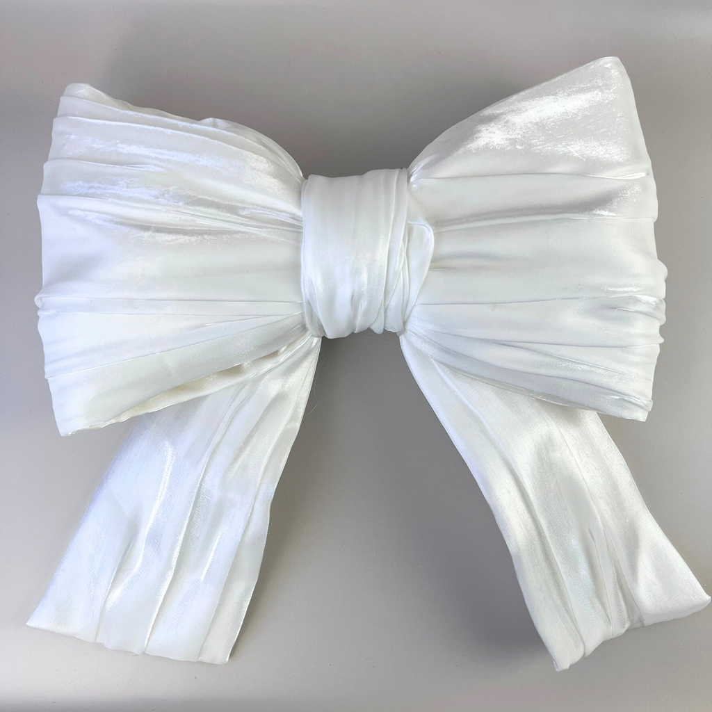 Oversized 30cm white bow against a plain background