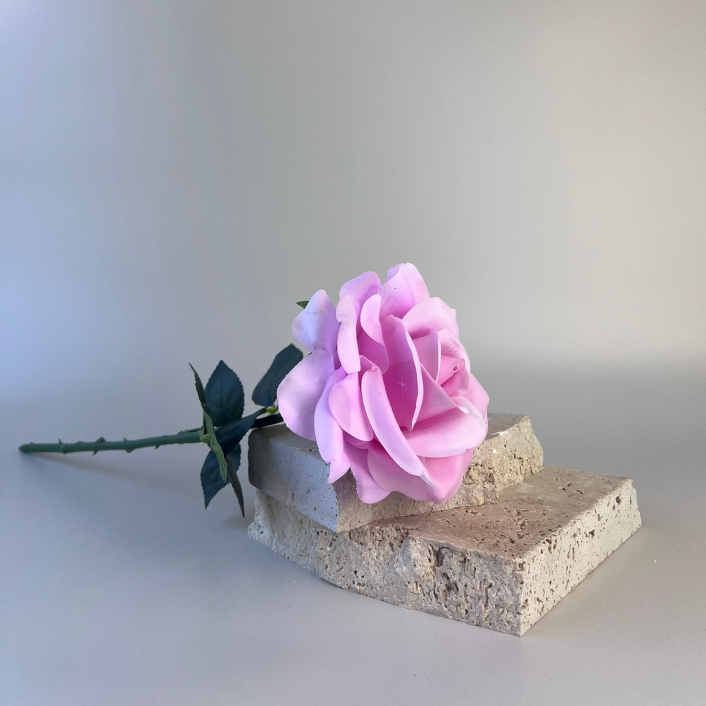 Soft purple real touch artificial rose styled with props