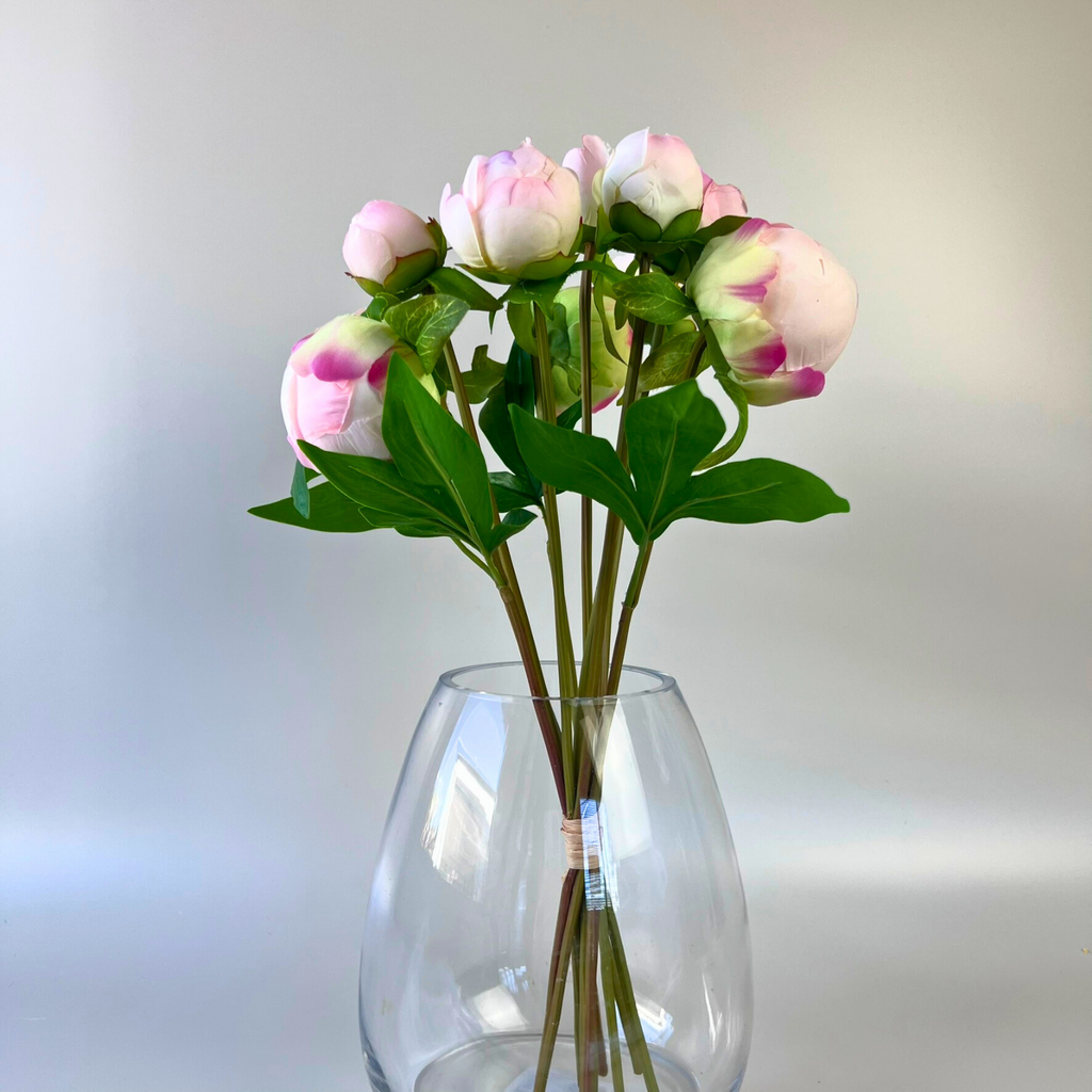 Soft pink and hot pink blended peony artificial bouquet styled in round glass vase 