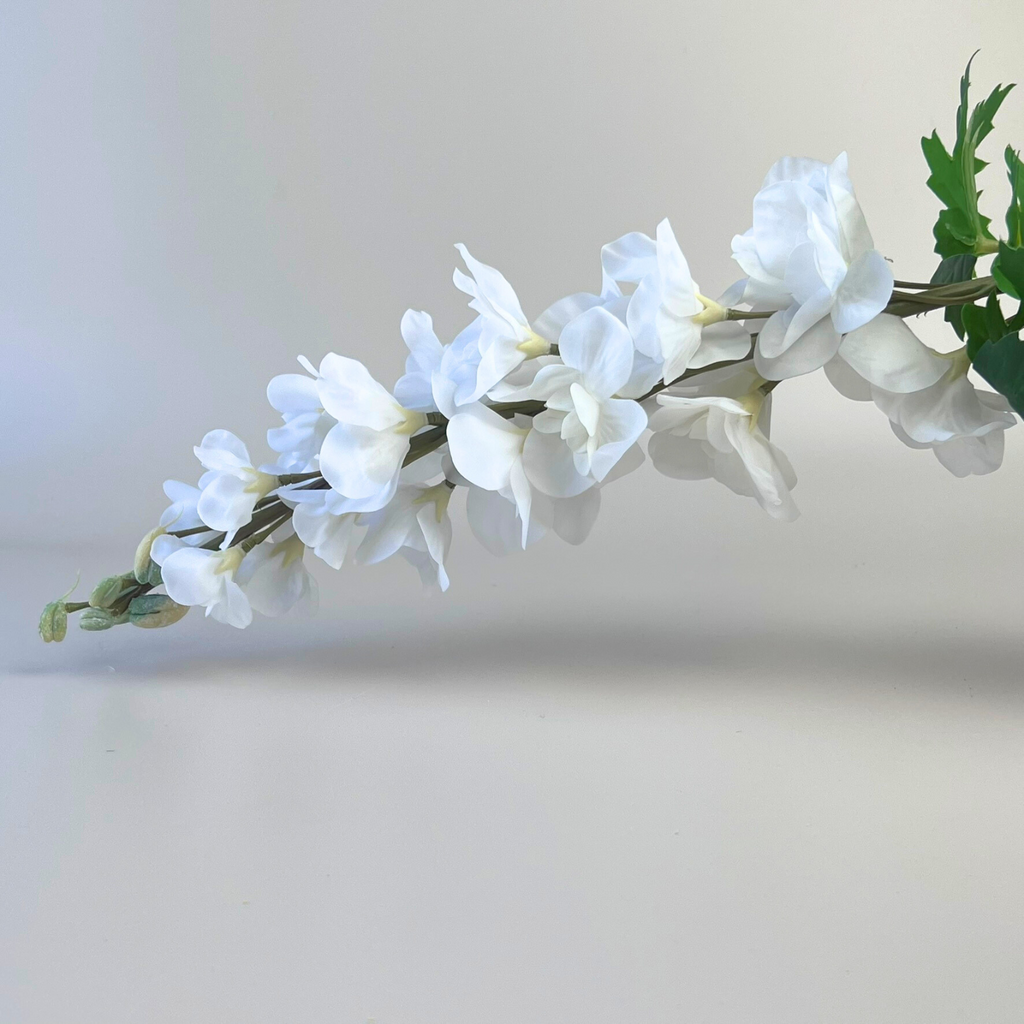 White artificial delphinium on an angle