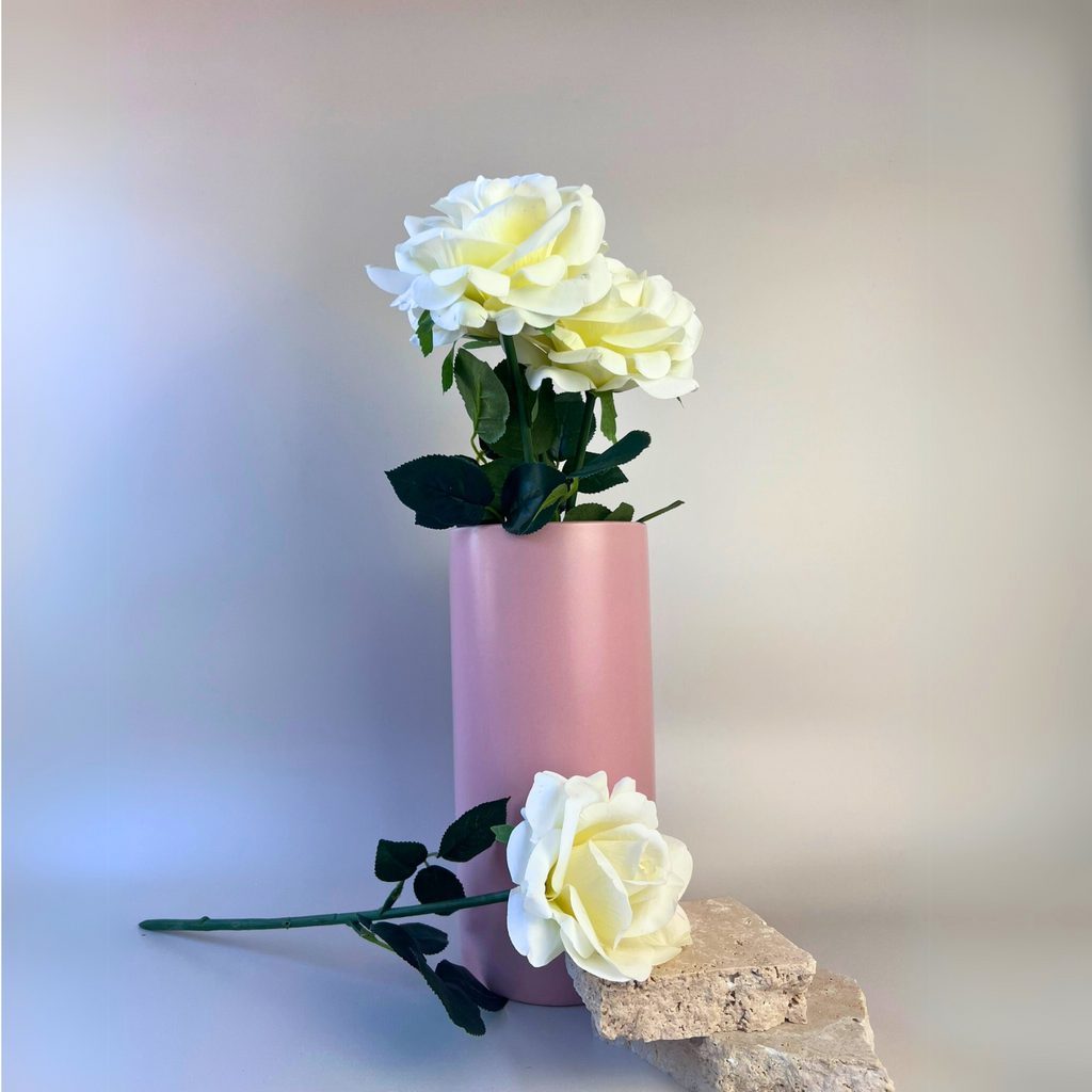 Pink clay ceramic cylinder vase styled with white roses 