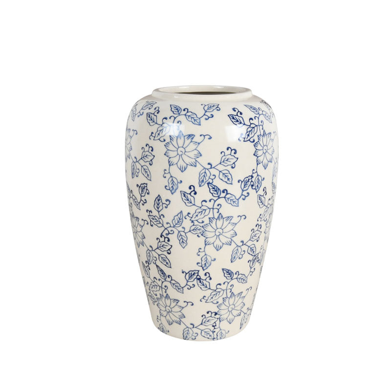 White and Blue Ceramic Vase with a floral design against a plain white background