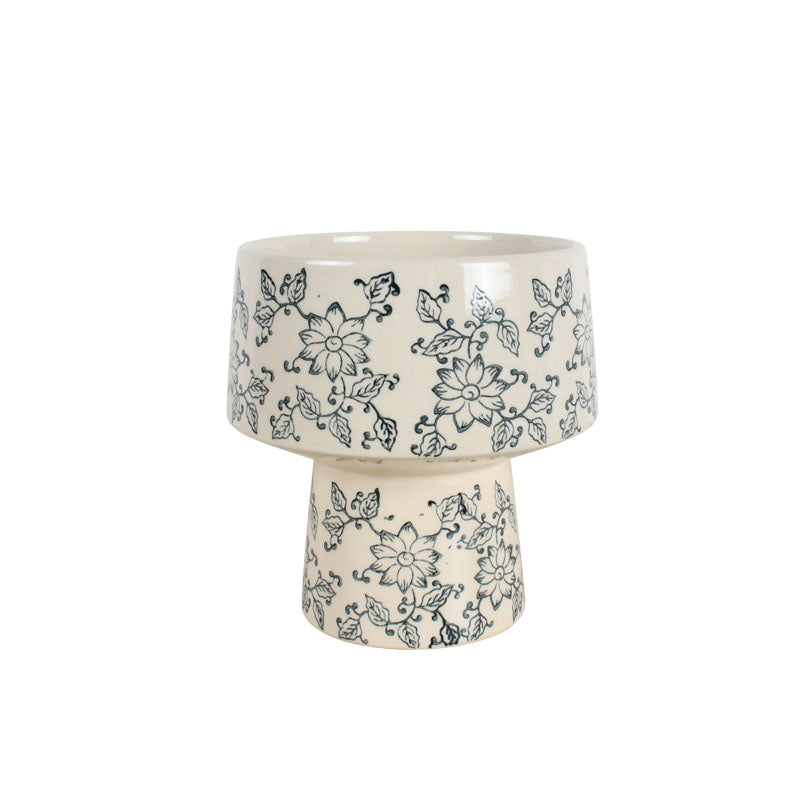 Rounded 17cm white ceramic vase with a soft blue floral design against a white background
