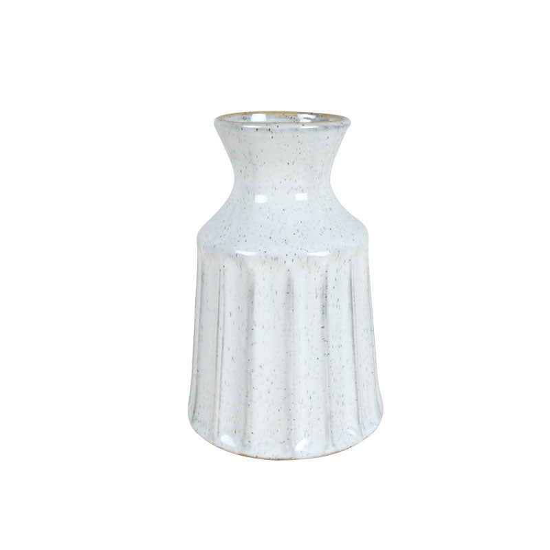 White vintage ceramic vase with a speckled finish against a white background