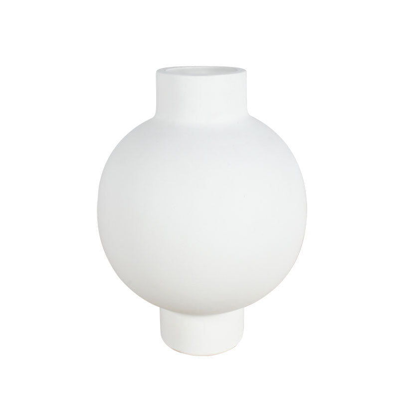 Unique rounded 15cm white ceramic vase on a white background