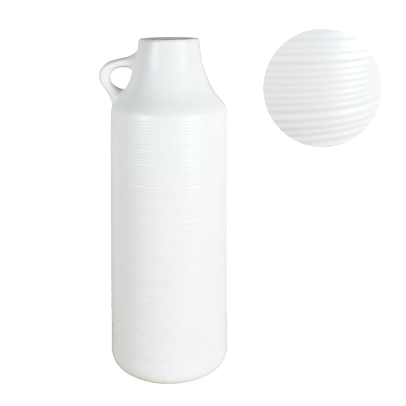 Tall white vase with a ribbed texture against a white background